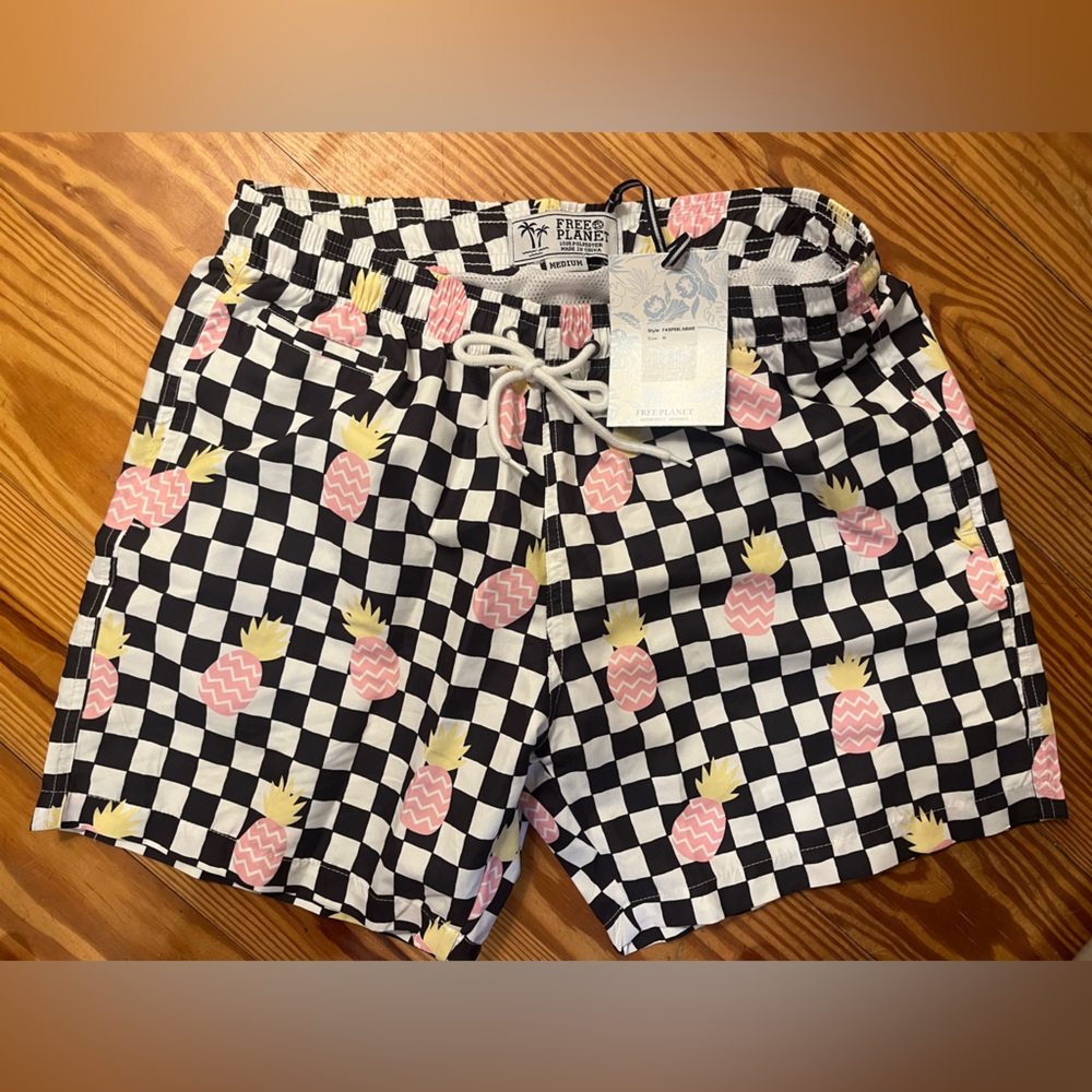 Medium Free Planet swim trunks NWT